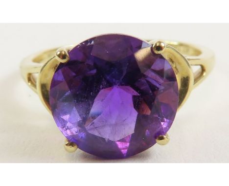 A 9ct gold amethyst single stone cocktail ring, the single amethyst  approximately 11mm round, finger size R 1/2, 3.18g gross