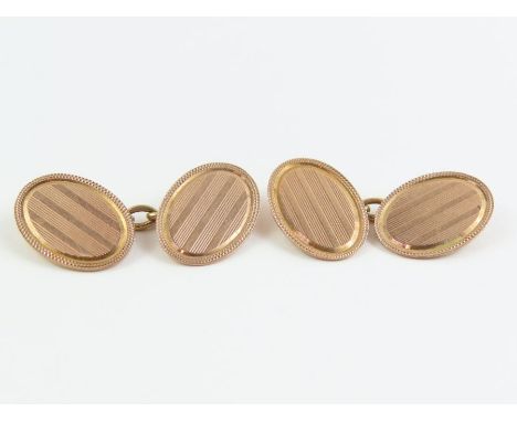A pair of 9 carat rose gold cufflinks, Birmingham 1929, with linear engine turned decoration, 6.3 g gross