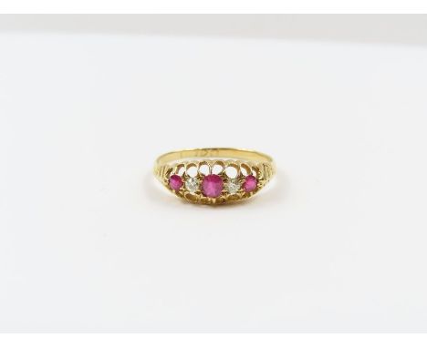 An 18 carat gold ruby and diamond dress ring, circa 1900, finger size R, 23.2 g gross