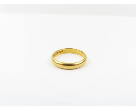 A 22ct gold wedding band, 3.1mm wide, finger size K, 3.55g gross
