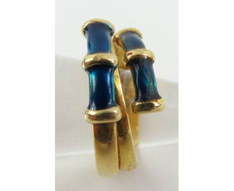 A dress ring with blue green enamel decoration, finger size L, 3.1g gross, tests as 9ct gold