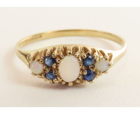 A 9 carat gold opal and sapphire set dress ring, finger size P, 1.5 g gross