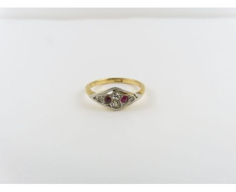 A ruby and diamond dress ring, stamped ‘18ct’, finger size L 1/2, 2.4 g gross