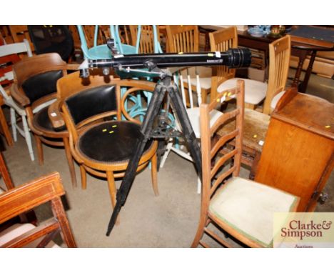 A Tasco telescope on tripod stand