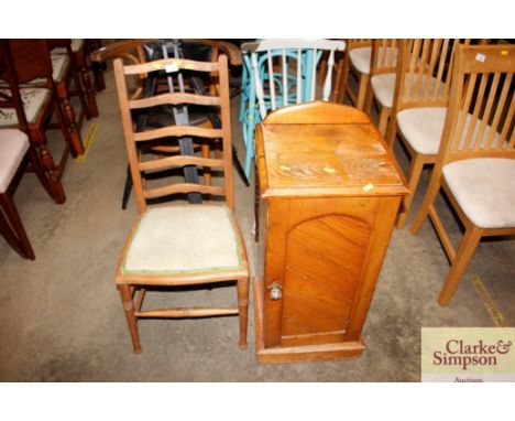 An Edwardian oak bed side cupboard and a beech ladder back chair