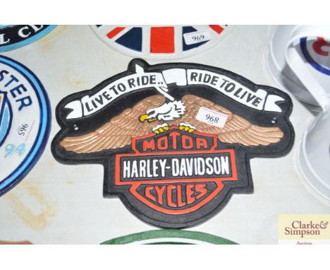 A reproduction cast iron Harley Davidson sign 