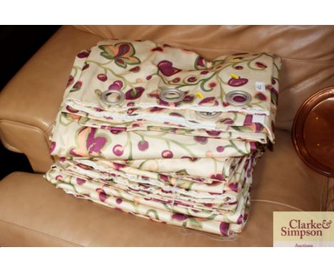 A quantity of floral patterned lined curtains 