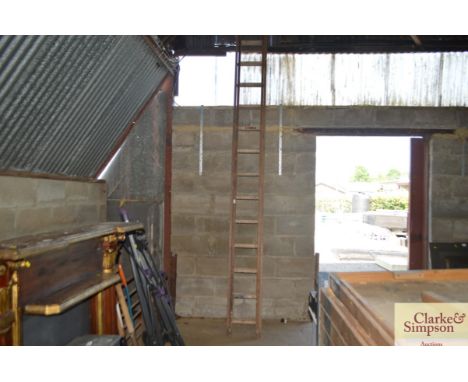 A wooden double extending ladder