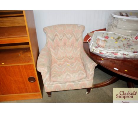A button back tub shaped armchair