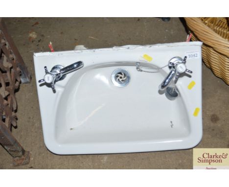 A hand basin and taps 