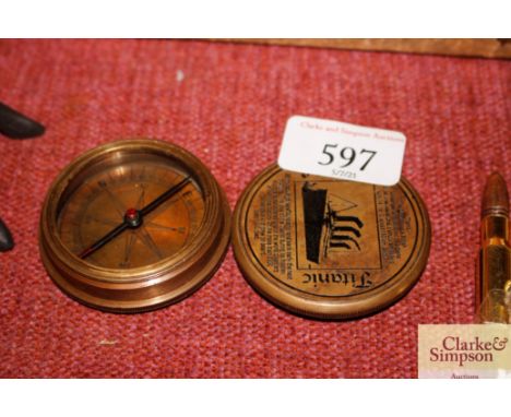 A brass Titan style pocket compass