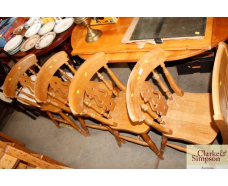 A set of four pine stick-back kitchen chairs