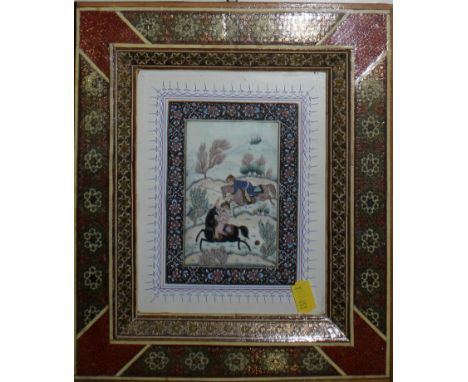 An Oriental miniature on ivory depicting central Asian horseman playing an early form of polo, indistinctly signed, framed an