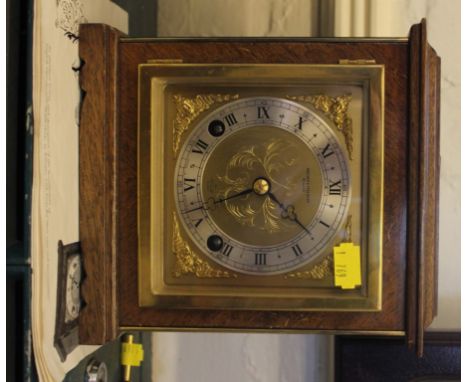 A early 20th century Elliot of London mantle clock, retailed by Bracher and Sydenham, Reading with brass face and bezel, Roma