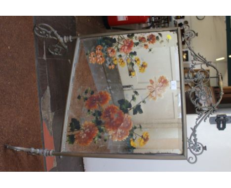 An early 20th century oblong brass framed fire screen with profuse fret work to the top on a trestle base