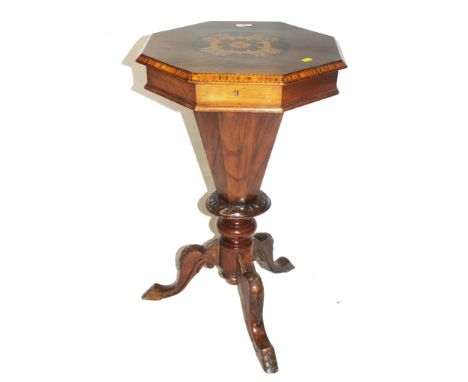 A Victorian walnut and mahogany octagonal-shaped lady's workbox with elaborate marquetry to the top, fitted interior, carved 