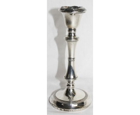 A single silver candlestick, as found