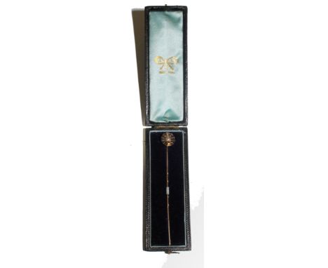 A tie pin with a rose diamond and enamel shell in original case