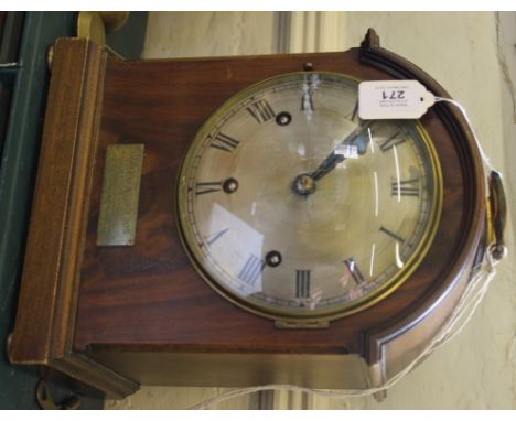 A Victorian mahogany mantle clock by Lawson and Sons Ltd, Brighton with domed top, brass drop handle, circular dial with Roma