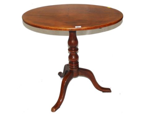 A 19th century mahogany tip-top oval centre or occasional table with shaped top, baluster shaped central support on a tripod 