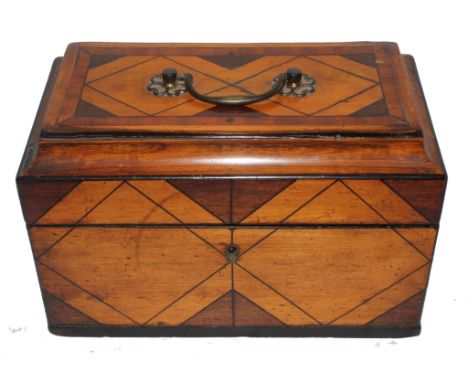 A 19th century Continental mahogany satinwood and overall ebony inlay tea caddy with brass handle and escutcheon with lined i