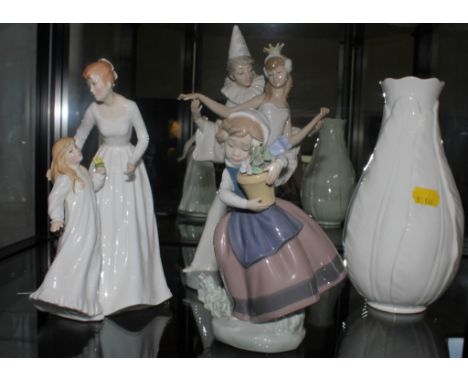 A Lladro figurine of a clown with ballerina, 26cm high, a Lladro figurine of a girl with flowers, 17cm high, a Royal Worceste