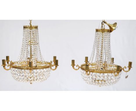 A choice pair of cut glass and gilt metal six branch chandeliers
Each of pear shape form with pendant glass floret's, each li