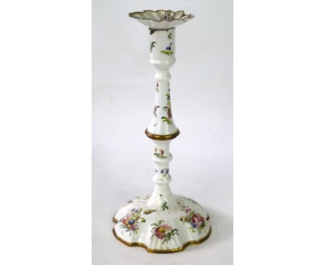 A Bilston enamel candlestick, late 18th Century/early 19th Century 
The white enamel profusely decorated with flowers, with d