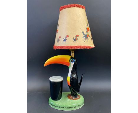 A Guinness toucan table lamp by Carltonware, with original shade, restored.