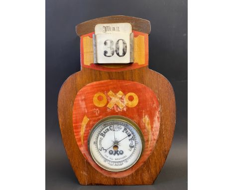 An OXO combined barometer and calendar, in the shape of a jar, 8 1/2 x 12 1/2".