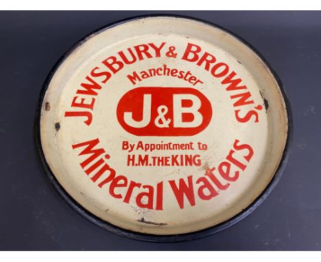 A circular enamel pub tray advertising Jewsbury &amp; Brown's Mineral Waters of Manchester, 10" diameter. 