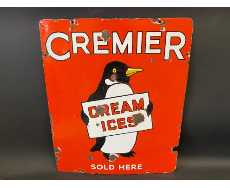 A Cremier Cream Ices Sold Here pictorial enamel sign depicting a penguin, 20 x 24". 