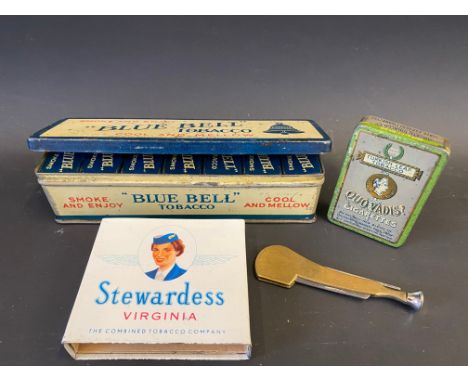 A Bluebell Tobacco tin of dominoes, the dominoes being tinplate also plus a Stewardess tin, a brass tobacco pipe tamper etc. 