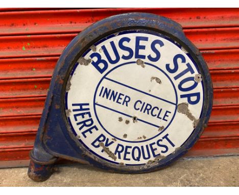 A Buses Stop Here by Request Inner Circle double sided enamel sign within heavy metal frame, 23" diameter.