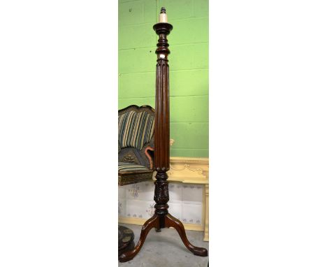 A mahogany tripod standard lamp 