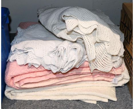 A candy pink and light pink double sided quilt, worked in places with leaf design, 196cm by 220cm; a cream quilt worked in pl