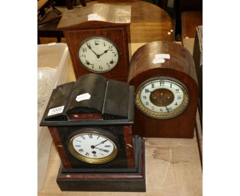 A Victorian black slate and red marble mantel timepiece and two striking mantel clocks