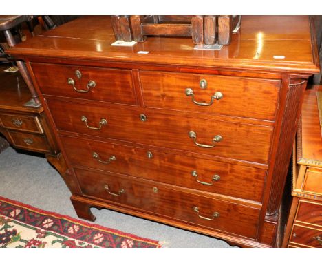 A 19th century mahogany chest of drawers with fluted columns on bracket feet (split to top)