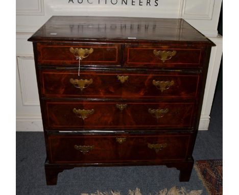 An 18th century walnut line inlaid chest of drawers with cross banded top on bracket feet 