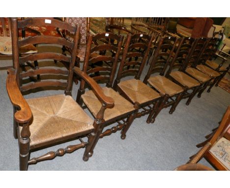 A set of eight Lancashire ladder back, rush seated chairs 
