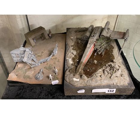 ICONIC MODEL OF LUKE SKYWALKER CRASHED X WING FIGHTER WITH A MODEL OF EWOKS IN BATTLE WITH AT AND T REBEL FIGHTERS