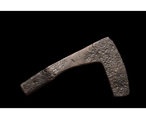 Ca. 900-1100 AD. An iron bearded axe head with a slender and long curved blade and a square-section poll that may have been u