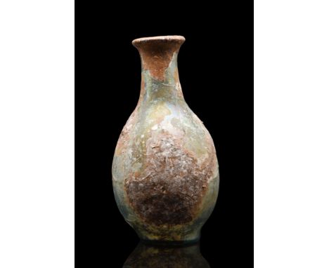 Ca. 100-300 AD. A beautiful glass flask with a bulbous body with an attractive rainbow iridescence, a flaring cylindrical nec