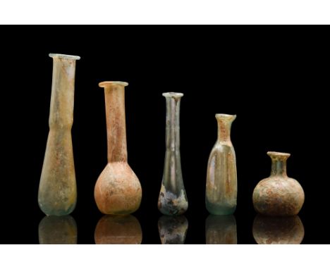 Ca. 100-300 AD. A group of five glass flasks including the piriform, the cylindrical, and the globular. The piriform is the m