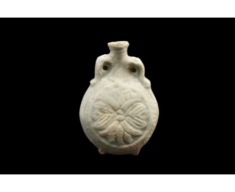 Ca. 660-525 BC. This Ancient Egyptian New Year’s faience flask is a beautiful and intricate piece of artwork from the 26th Dy