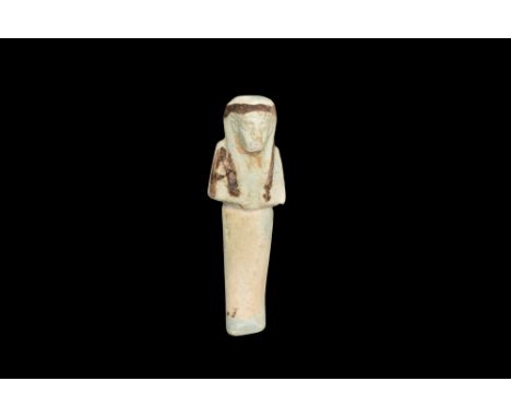 Ptolemaic Period, Ca. 332 BC. An ancient Egyptian mummiform faience figure wearing a plain tripartite wig and a divine beard.