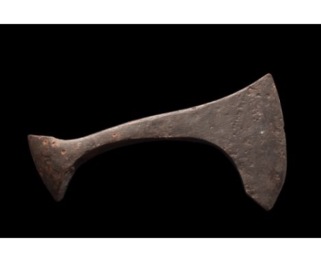 Ca. 900-1100 AD. An impressive iron bearded axehead with a curved blade and elliptical shaft-hole. A wooden pole would have b