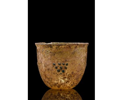 Ca. 400-500 AD . A lovely Roman cup/beaker with knobbed decoration gathered into a triangle. The vessel is defined by its sli