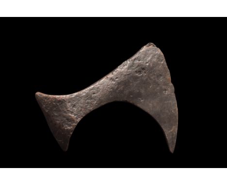 Ca. 900-1100 AD. An iron bearded axe head with an elongated, curved blade and tapering cheek. The bearded axe, or Skeggøx (fr