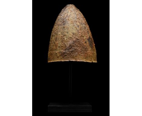 Ca. 900-1000 AD. Rare Viking period iron helmet; of elongated form in triangular sections; attached with iron rivets passing 